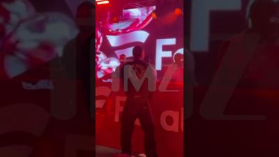 Travis Scott Pulverizes Sign on Video During PreSuper Bowl Performance